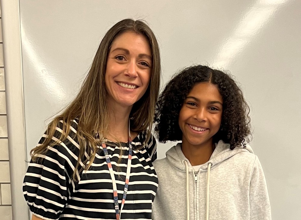 EIS 7th grader Jasmine Parran poses for picture with gifted ed instructor