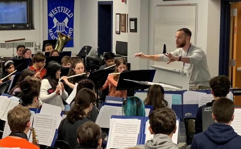 A music director directing an orchestra 