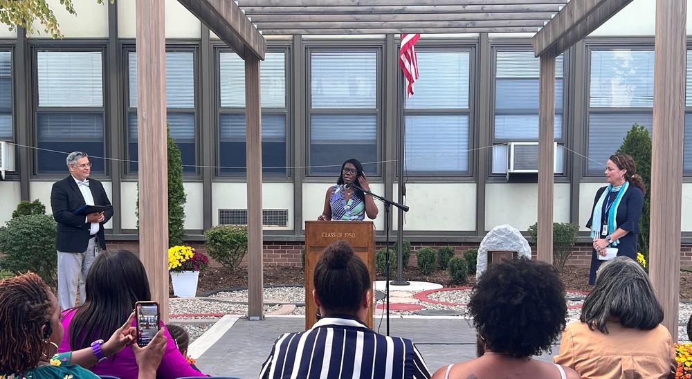 Sheronda Braker speaks during dedication of Dr. Derrick Nelson Memorial Courtyard