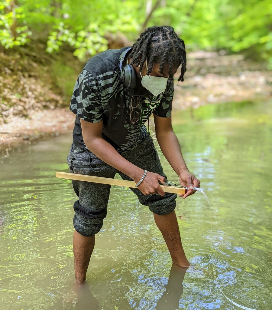 WHS student conducts test in stream