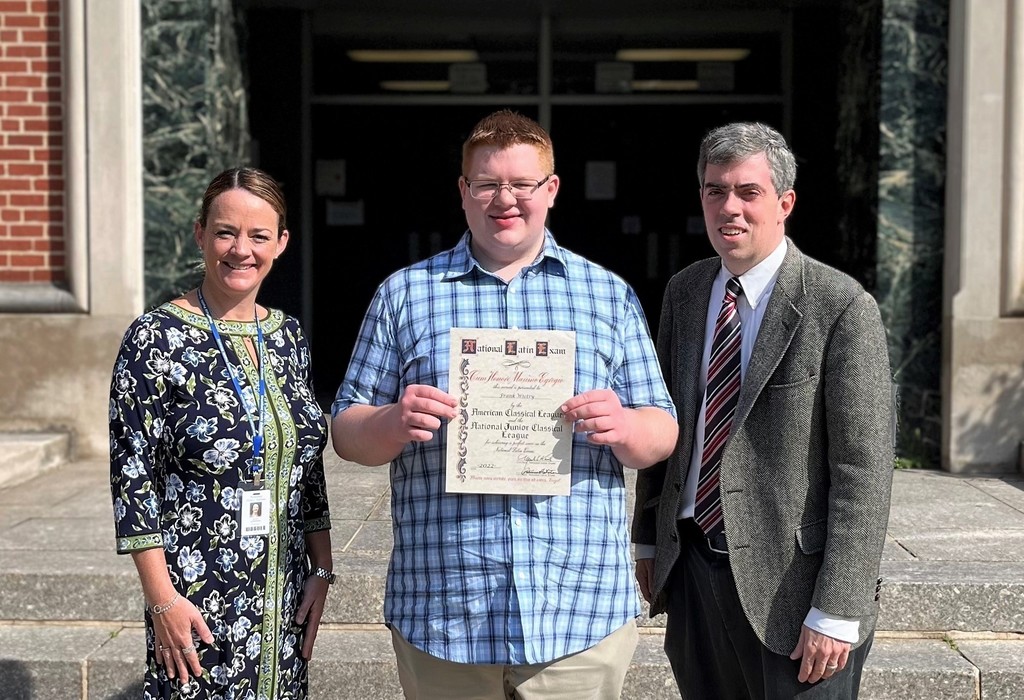 WHS senior Frank Wietry earned a perfect score on the Latin Level 2 exam.  The distinction of a perfect score was only attained by a very small number of students out of more than 100,000 who took the exam across the world.  Pictured here with WHS principal Mary Asfendis (L) and Latin teacher James Rowan (R).