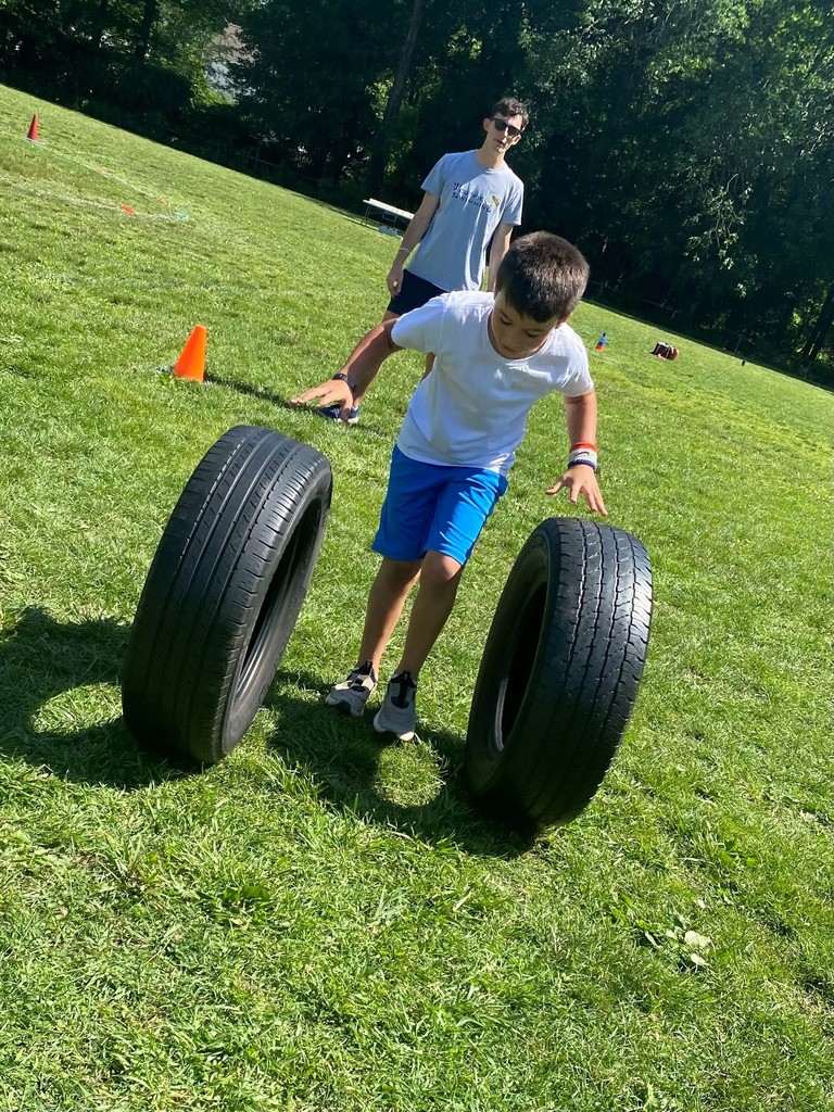 Washington 3rd grader rolls tires during Field Day