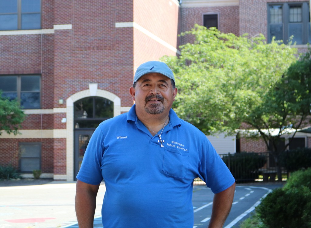McKinley head custodian poses for a picture outside