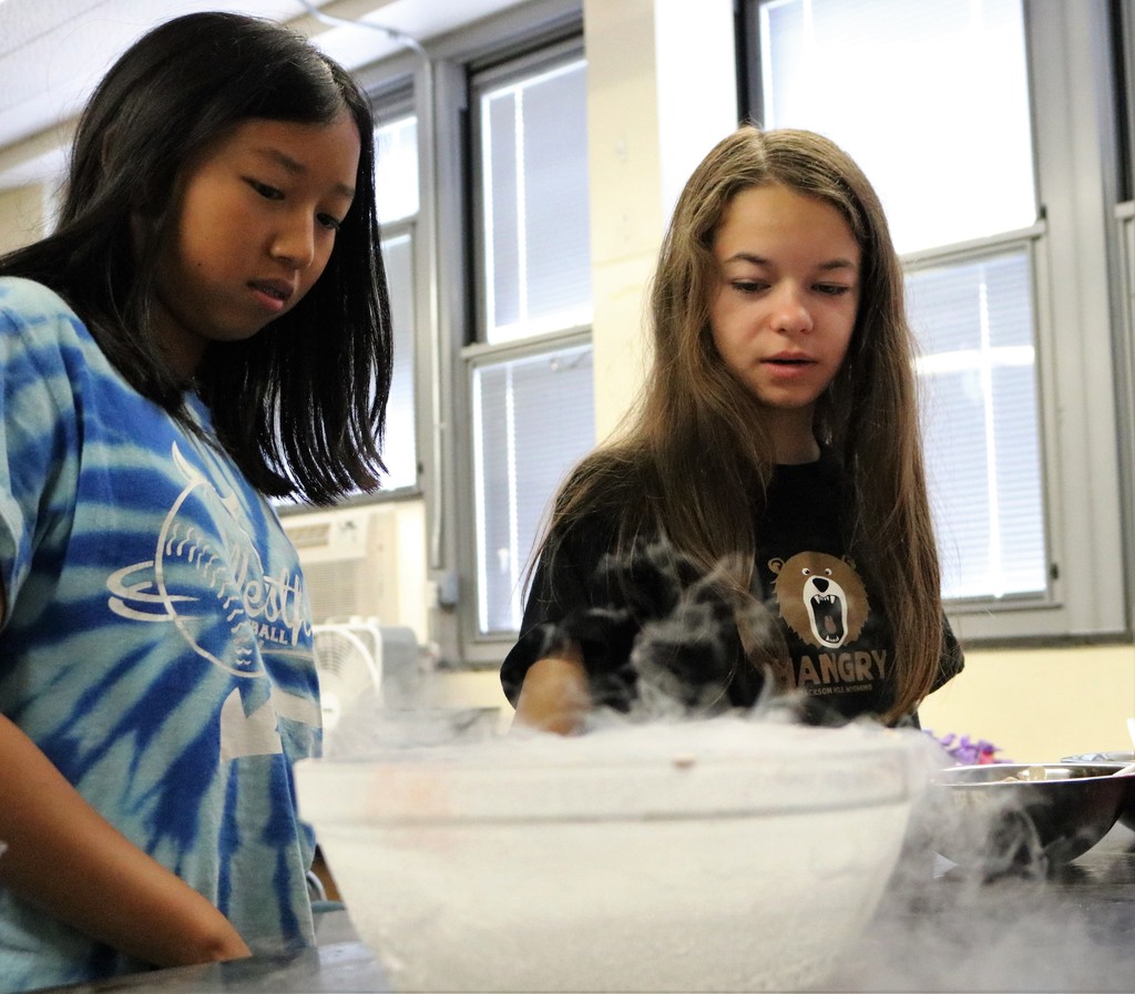 Two students at STEM Camp make ice cream
