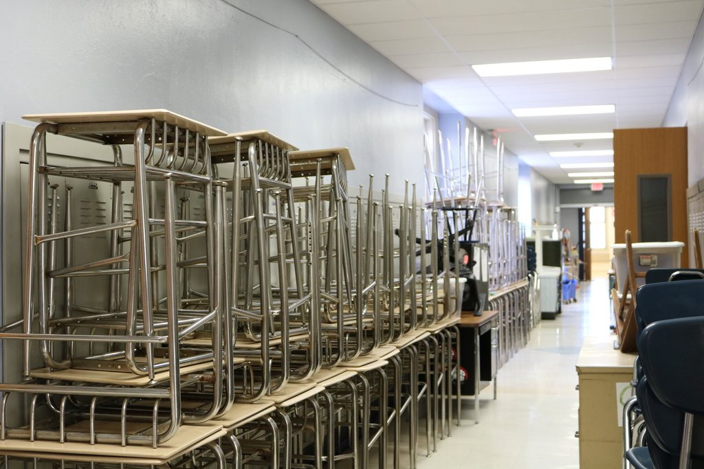 Classroom desks are stacked in a Roosevelt Intermediate School hallway