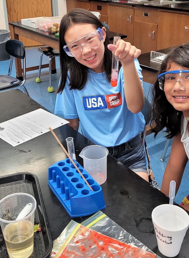 Two STEM campers enjoy a DNA session 