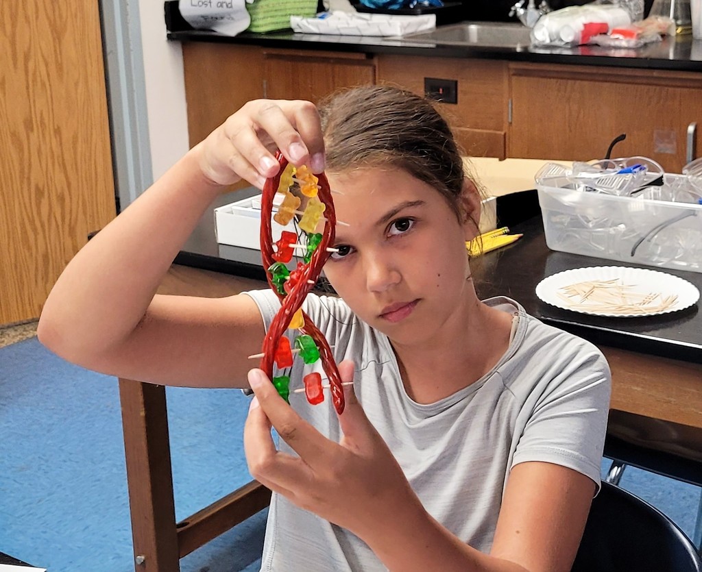 STEM camper shows off DNA model 