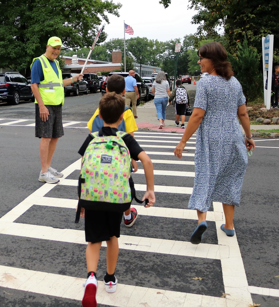 Tamaques crossing guard greets parent and students with a smile