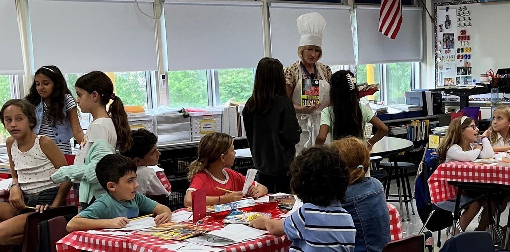 Washington 4th graders enjoy learning about different genres during a "book tasting."