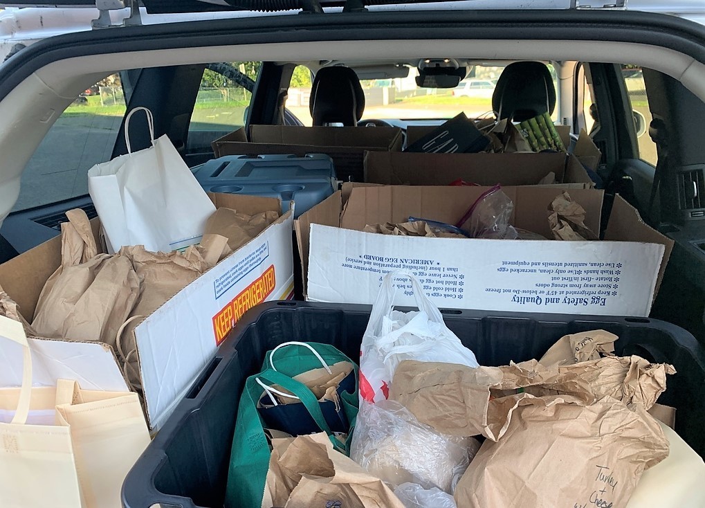 Back of car filled with donated lunches