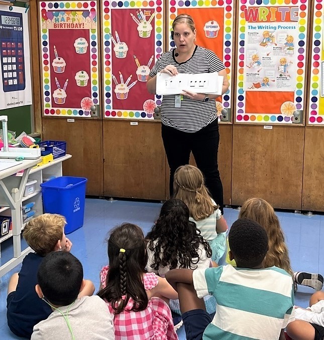Jefferson music teacher Mrs. Meyers shows musical notes to 3rd graders