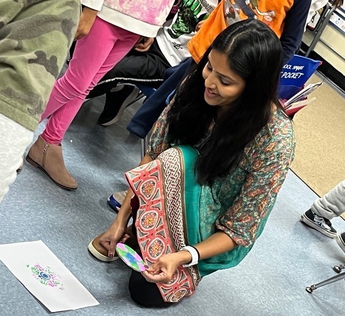 Jefferson parent demonstrates Diwali artwork craft for students
