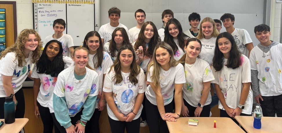 WHS chemistry students pose for picture wearing self-created Mole Day t-shirts