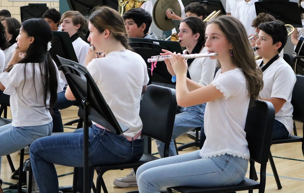EIS 8th grade flute players in band during Veterans Day Assembly.