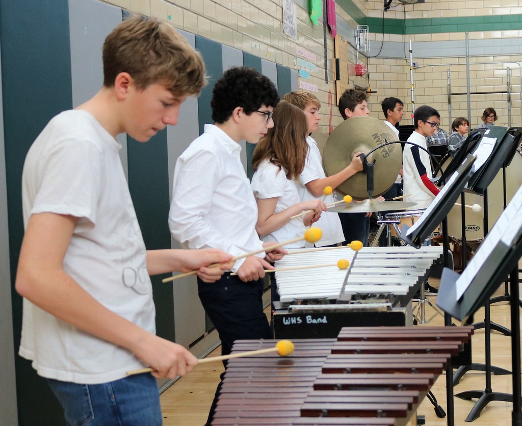 8th grade percussionists in band during Veterans Day Assembly