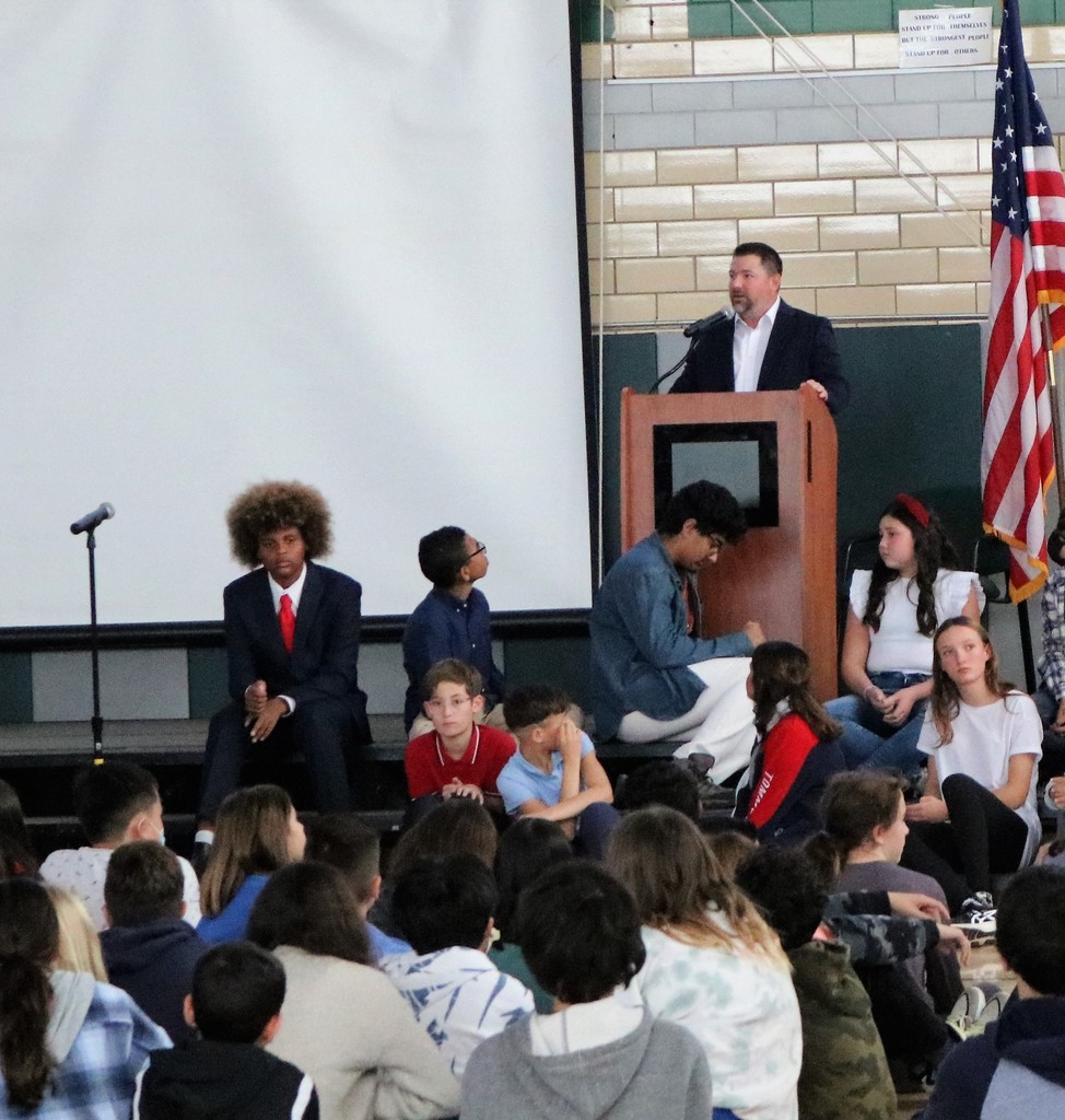 EIS Principal Dr. Matthew Bolton speaks during Veterans Day Assembly