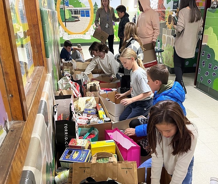 Jefferson students sort thru boxes of donated food