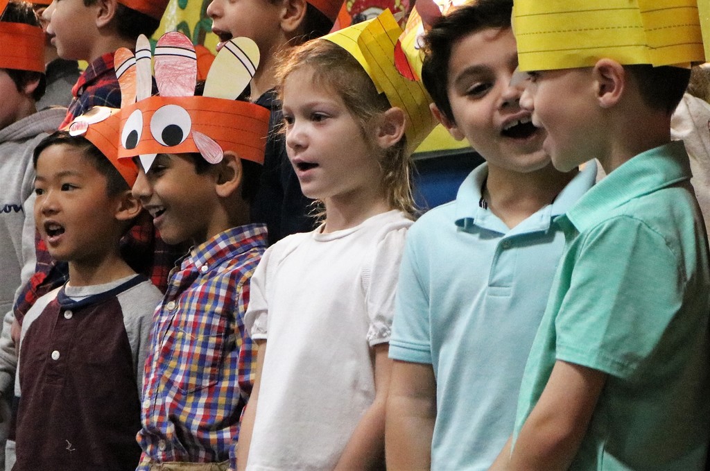 Washington 1st graders sing wearing handmade turkey hats