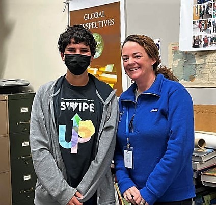 WHS student Aaron Taylor with principal Mary Asfendis