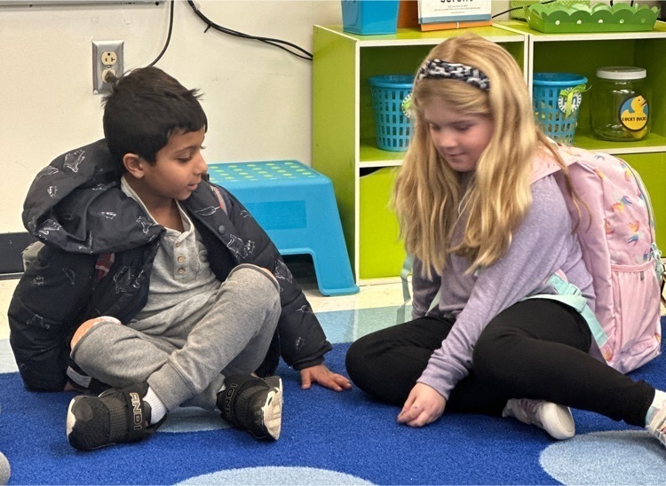 Two Lincoln kindergartners exchange kind words during circle time