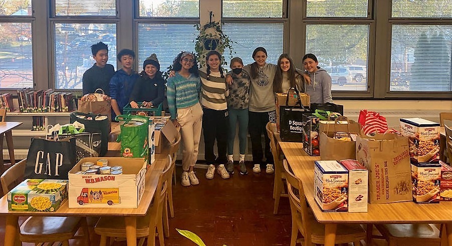 Edison SGA students pose with donated food for Thanksgiving Food Drive