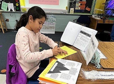 Jefferson 4th Grader working on realistic fiction assignment