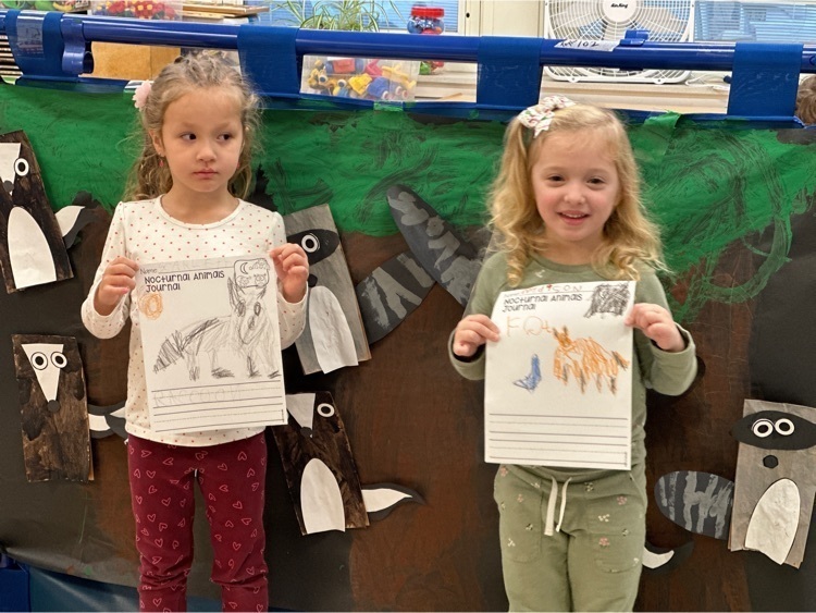 Two Lincoln Pre-kindergartners show work
