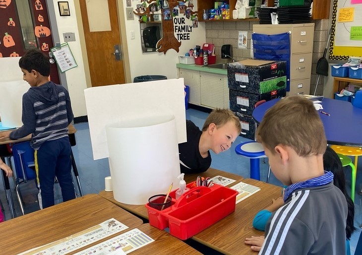 Two Jefferson 1st graders working on science project