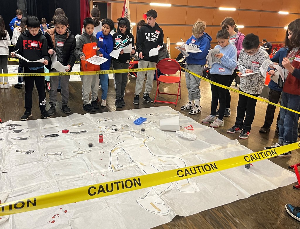 6th graders stand around "crime scene" during Gifted and Talented event