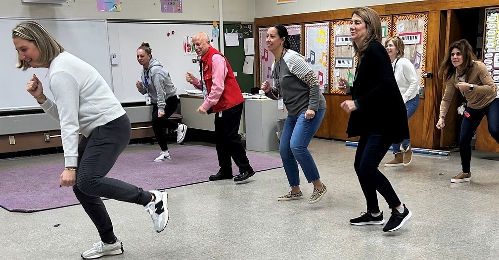 Washington principal and staff practice dance for annual school show