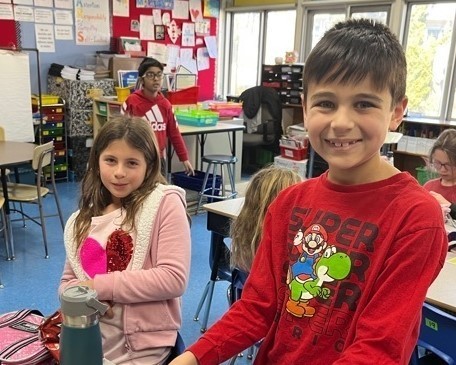 Two Jefferson students wear red and pink during Great Kindness Challenge