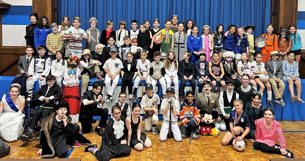 Group photo of 5th graders dressed as their "Wax Museum" famous person