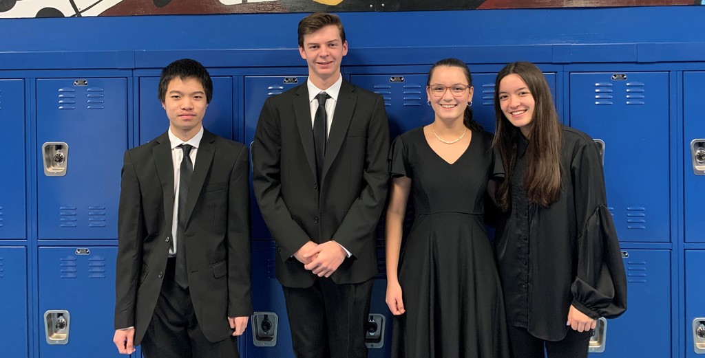 4 WHS student musicians pose for picture after being selected to perform with All-State Band