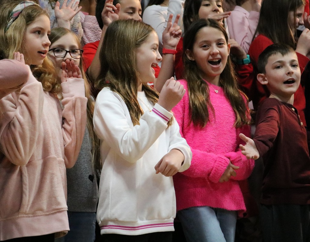 4th graders smile and clearly enjoy singing valentine songs