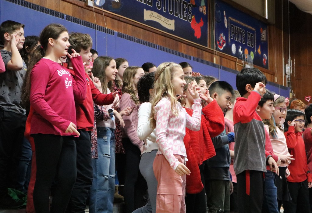 4th graders smile and sing Valentine songs