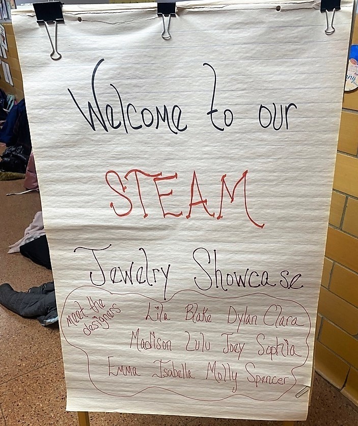 Sign saying welcome to STEAM Jewelry Showcase