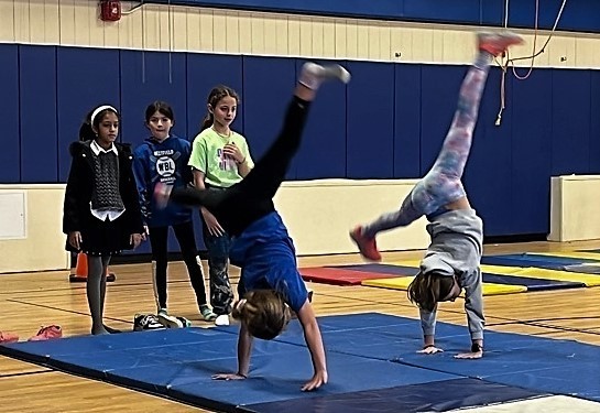 Two Jefferson students do cartwheels