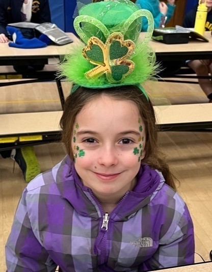 Student wears green St Pat's Day hat