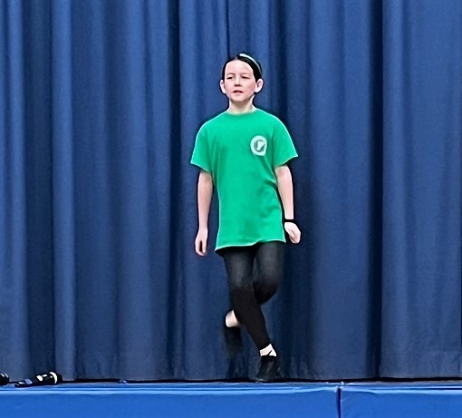 Student on stage doing Irish Step Dance