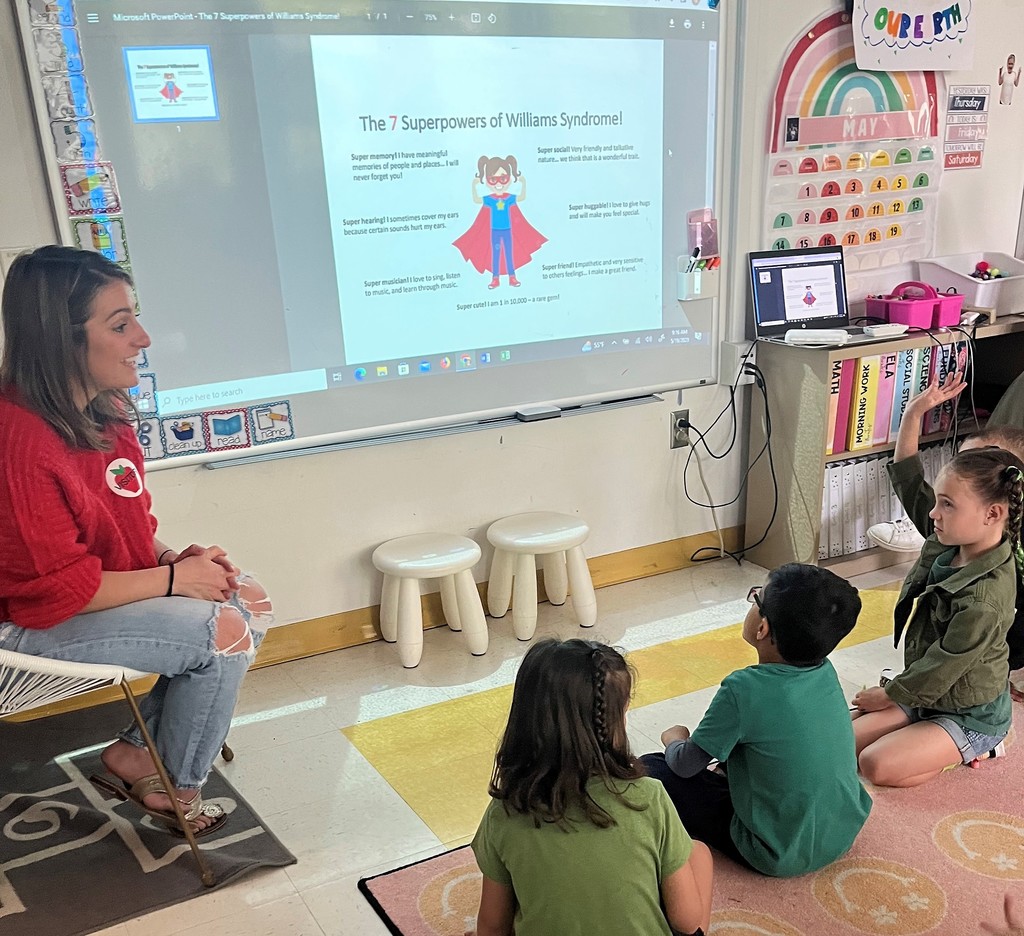 Parent talks to kindergarten class about Williams Syndrome, with presentation on screen