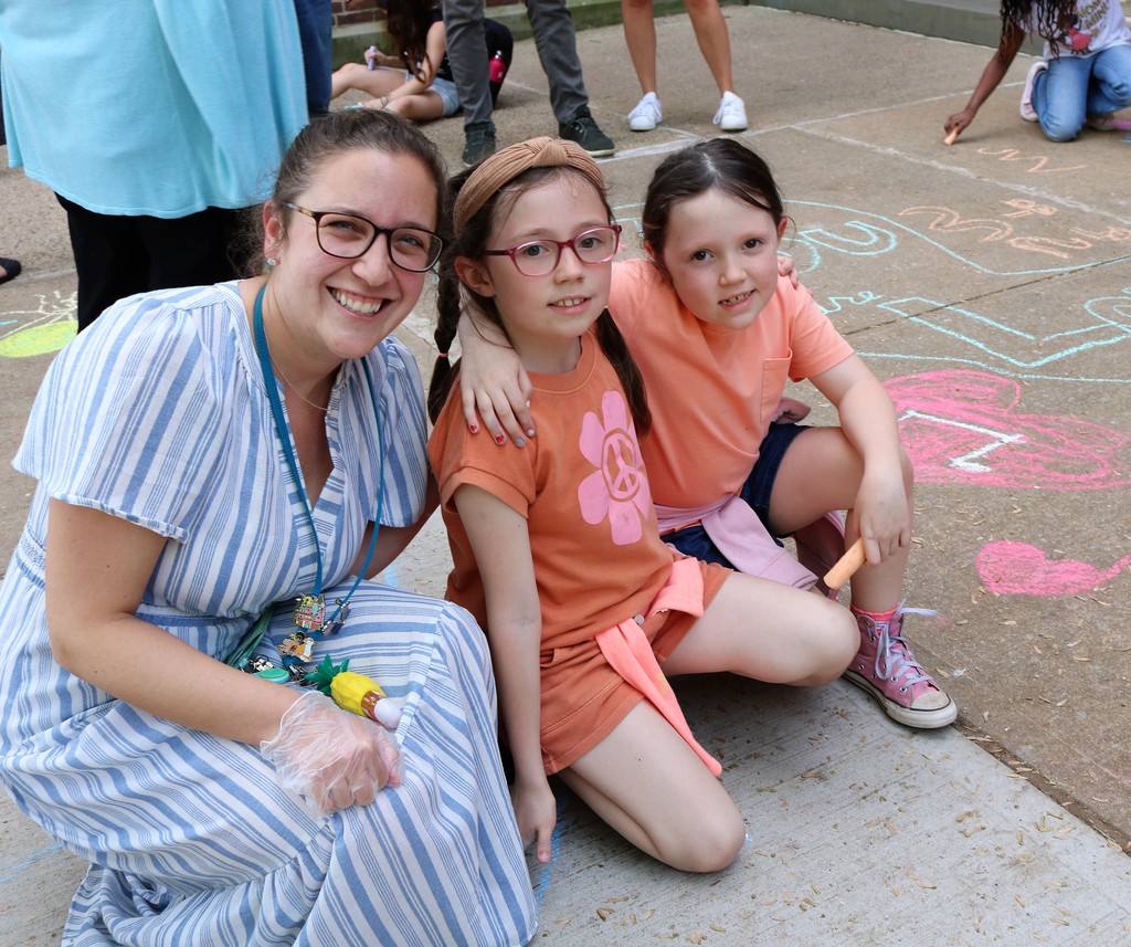 McKinley mother and daughters pose for picture during Chalk the Walk event