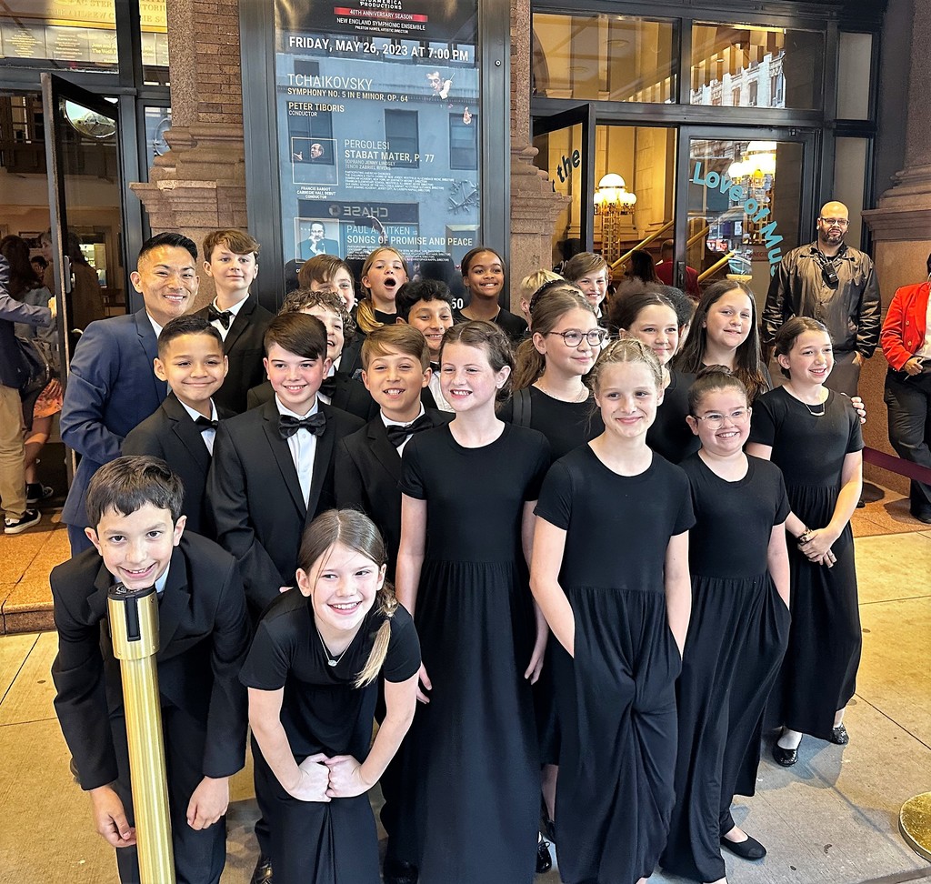 Group photo of Franklin Elementary choir and choral director in front of Carnegie Hall