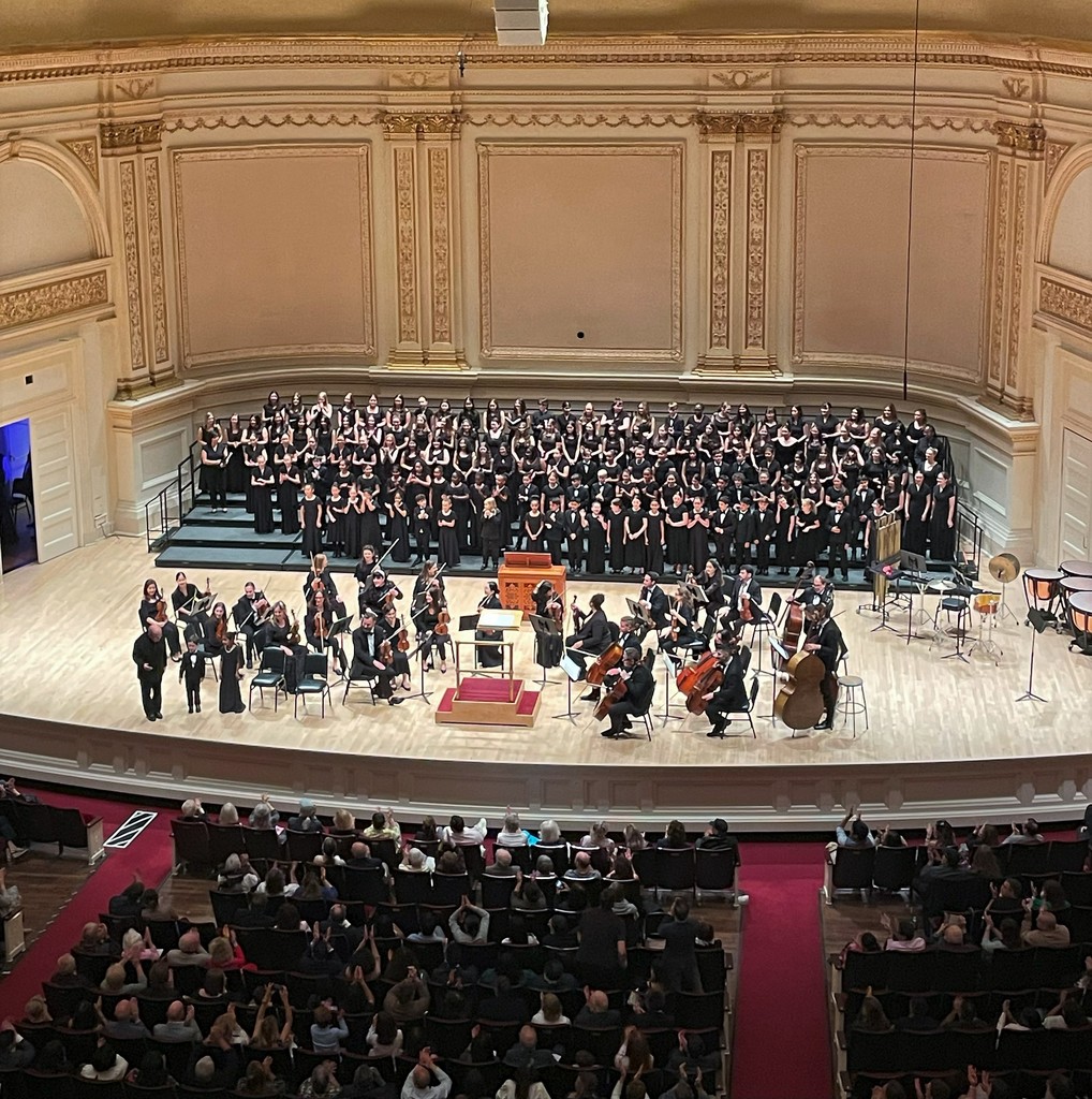 Wide shot of Carnegie Hall stage and performance